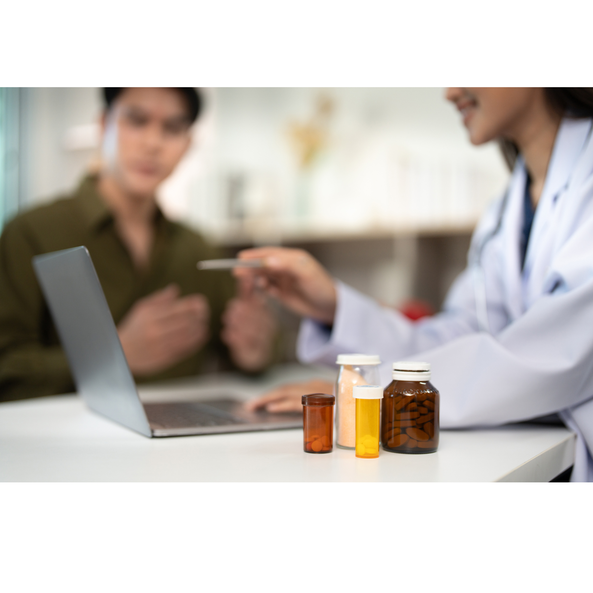 Healthcare professional discussing medication and nutrition plan with patient during clinic consultation