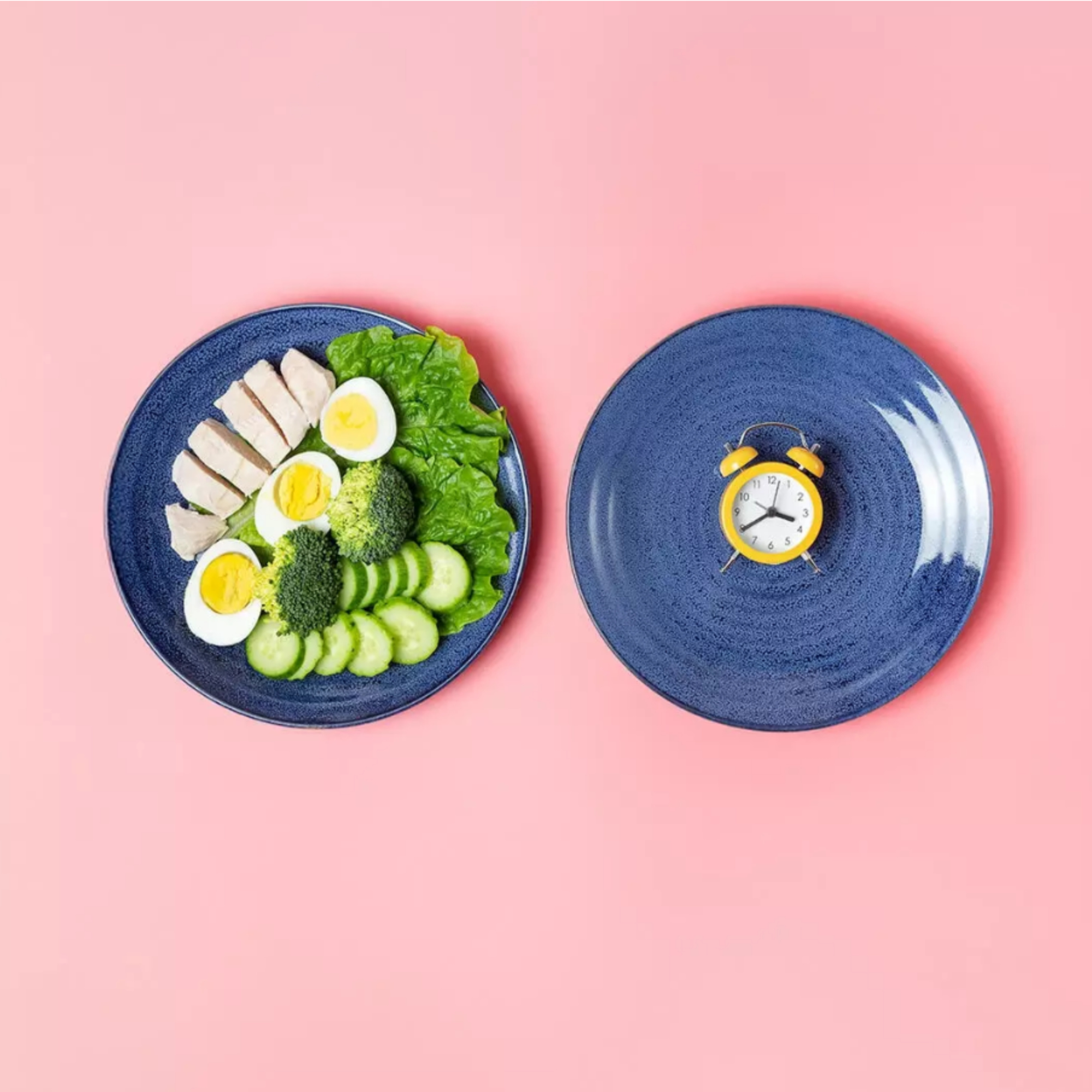 Plate with healthy food next to empty plate with clock representing intermittent fasting and eating window