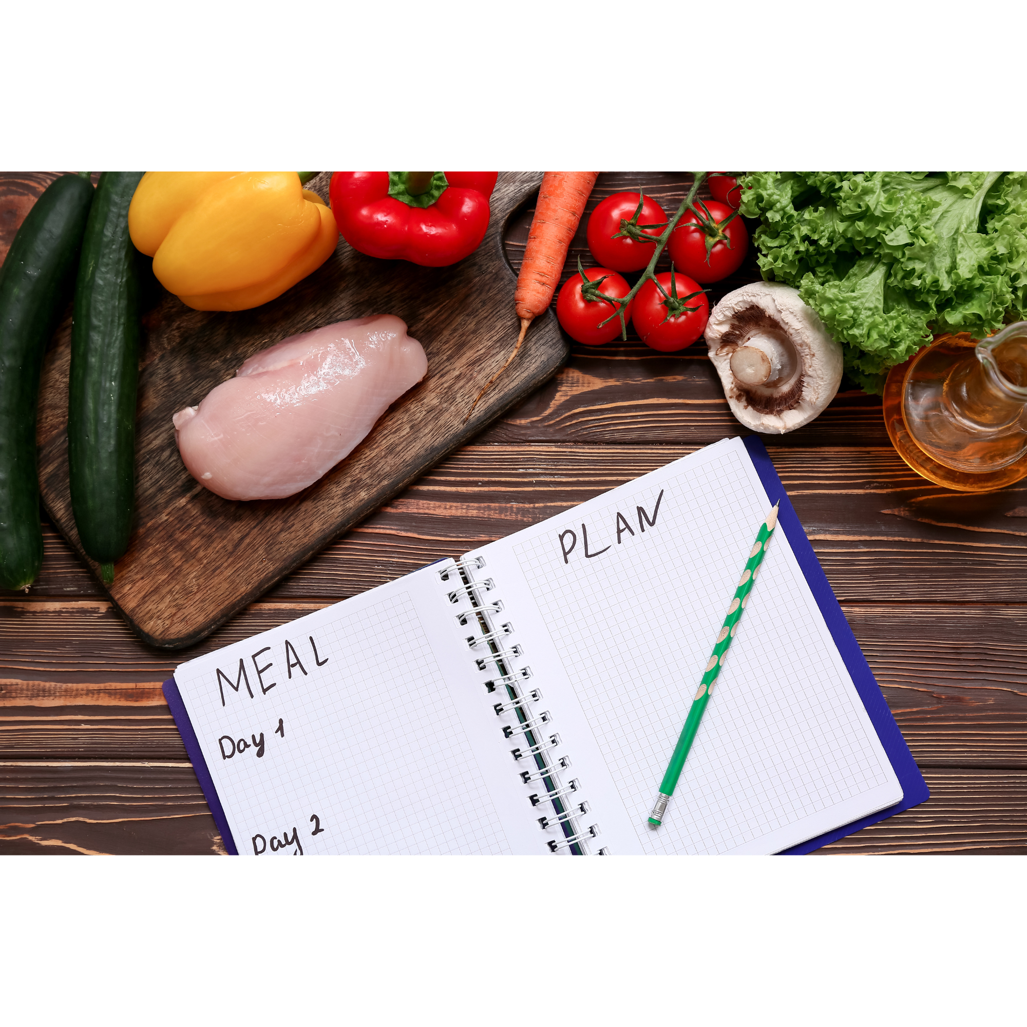 Meal planning notebook with fresh ingredients including chicken and vegetables for structured diet and nutrition planning